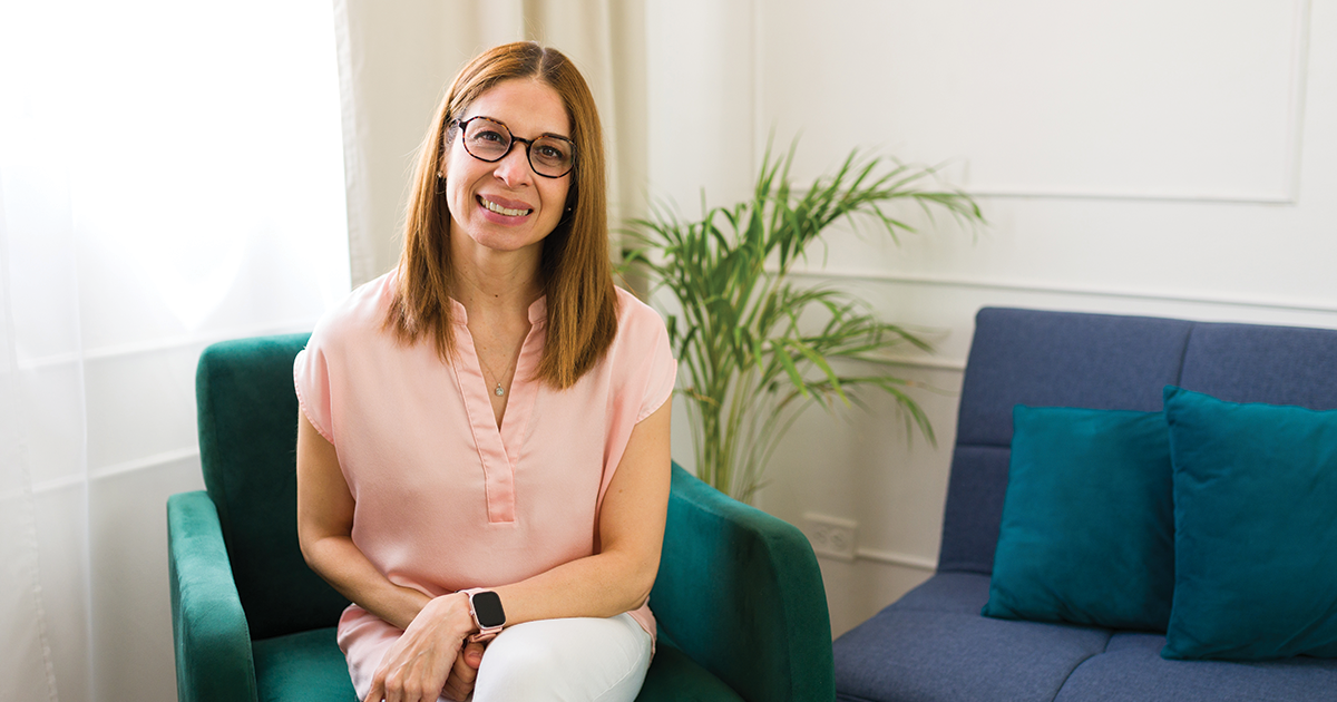 Woman sitting and learning the difference between therapy vs TMS.