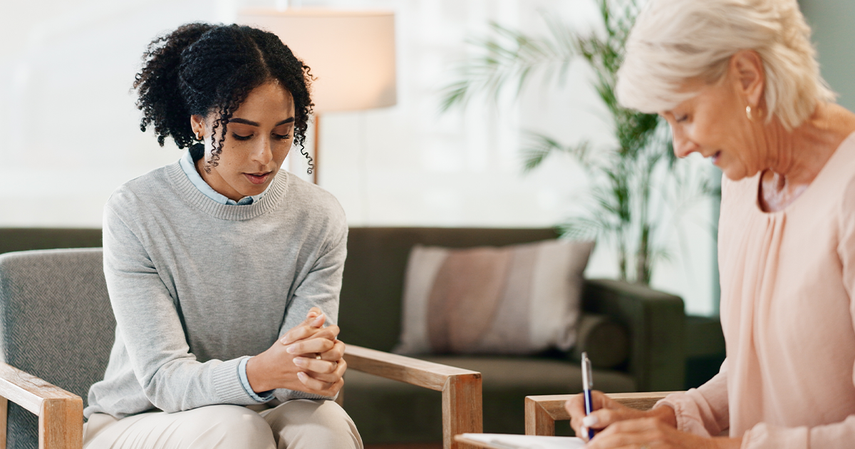 Woman attending therapy with her woman therapist
