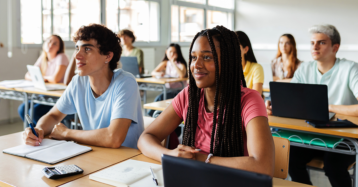 Adolescents sitting in a classroom who received TMS therapy