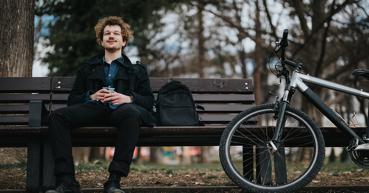 Man sitting on bench who received Theta Bust Stimulation