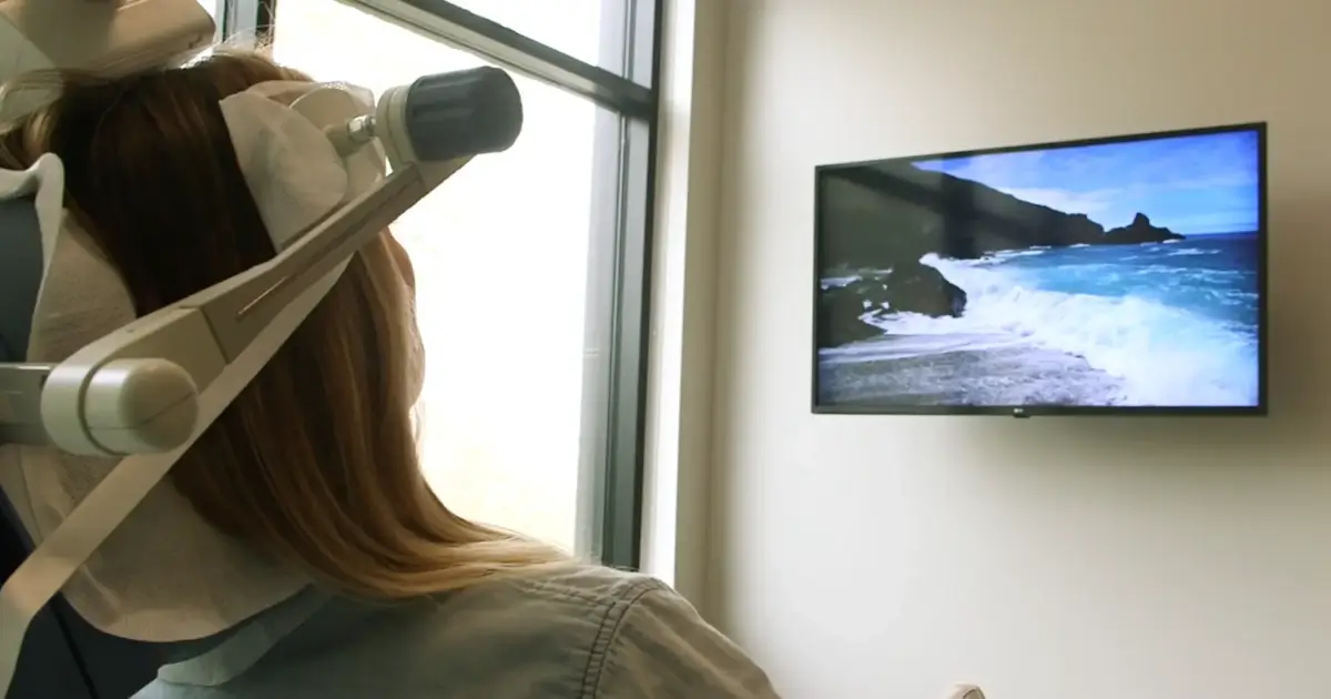 Patient watching video TMS