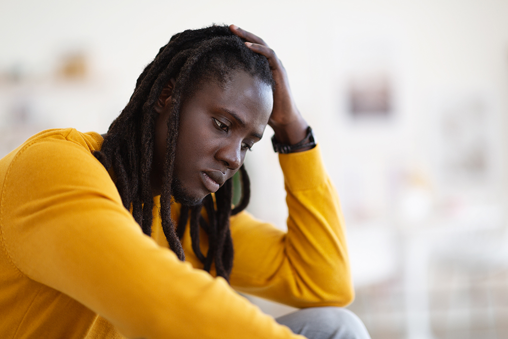 closeup portrait of depressed african