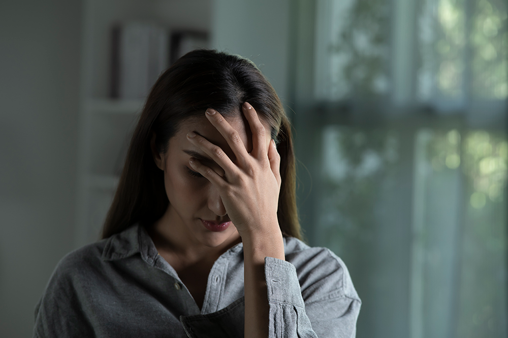 Sad and worried asian woman