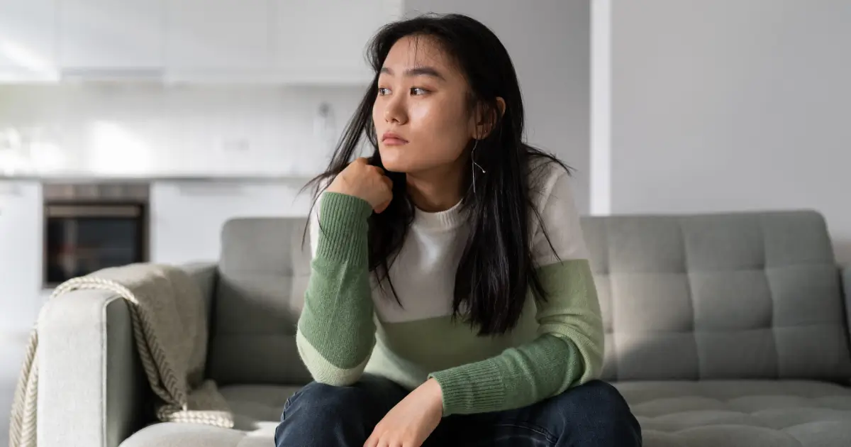 Sad lonely young asian woman img